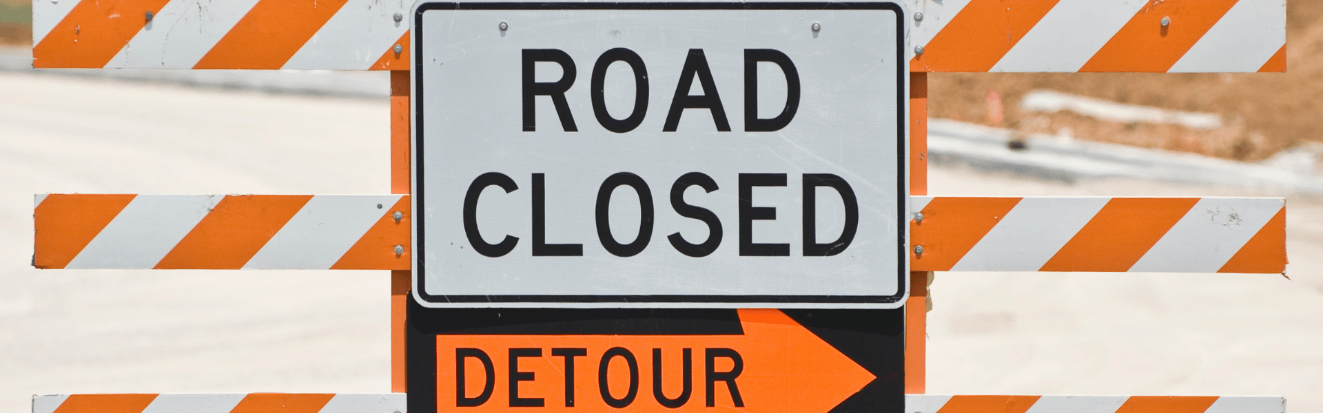 Detour road closed road sign