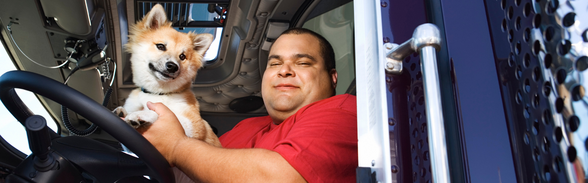 trucker in semi cab with dog