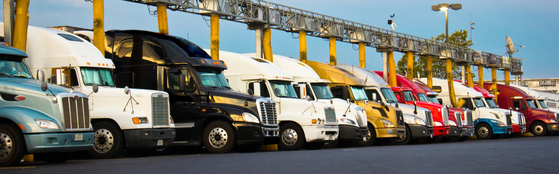semi trucks parked at truck stop