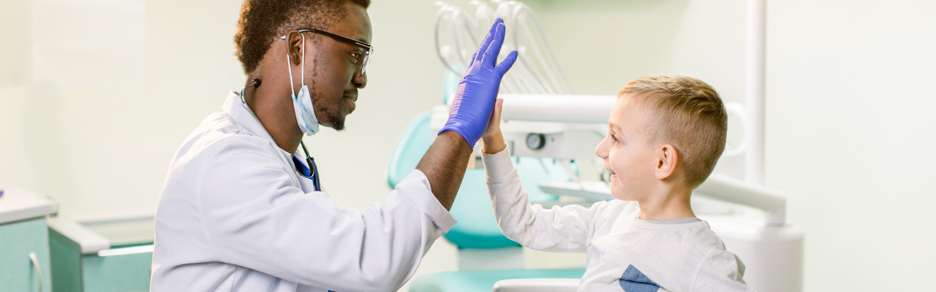 doctor high fiving child patient