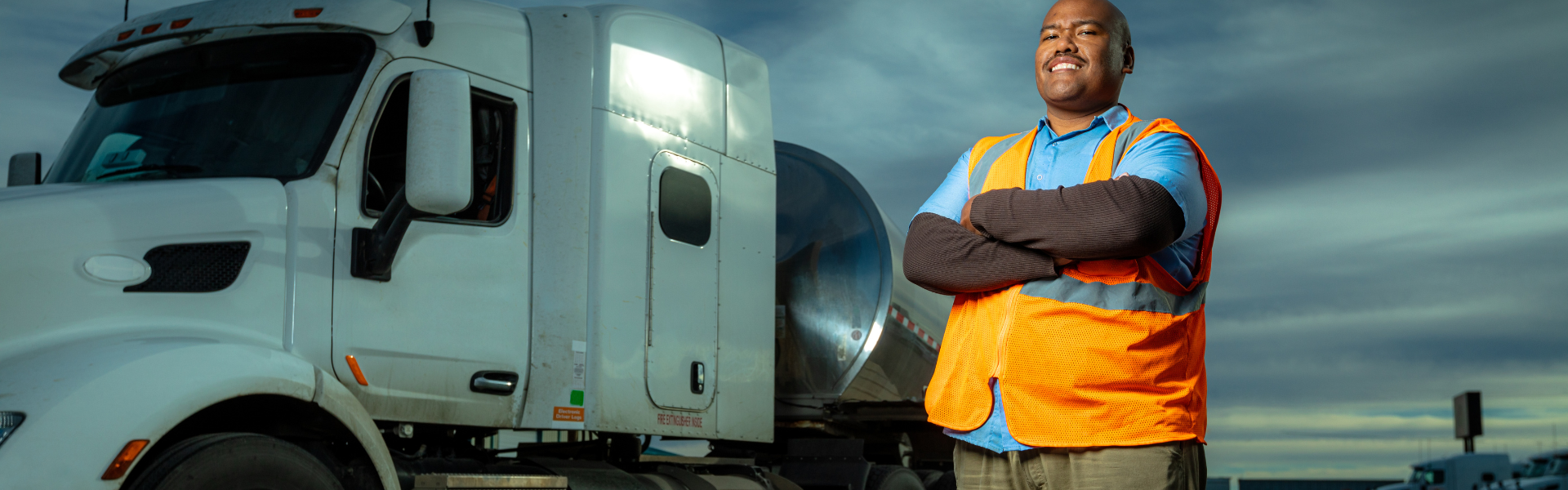 man standing in front of semi truck