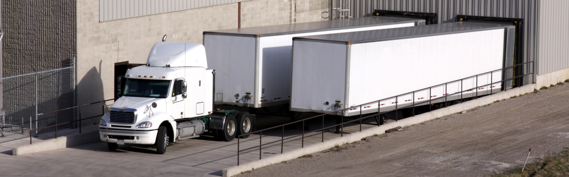 semi with trailer at a loading dock