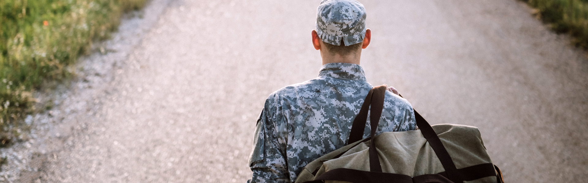 Veteran standing on road
