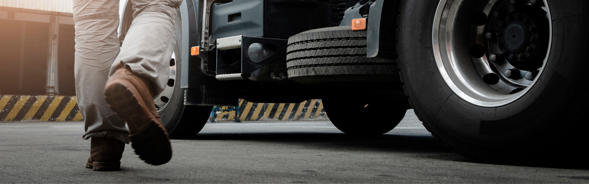 man walking toward semi truck