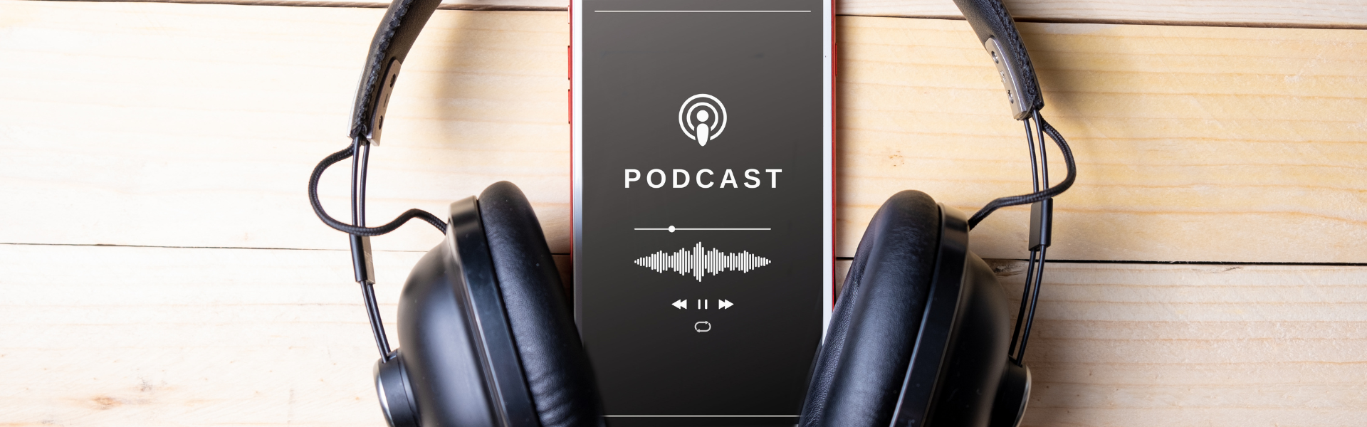 Phone playing podcast with headphones
