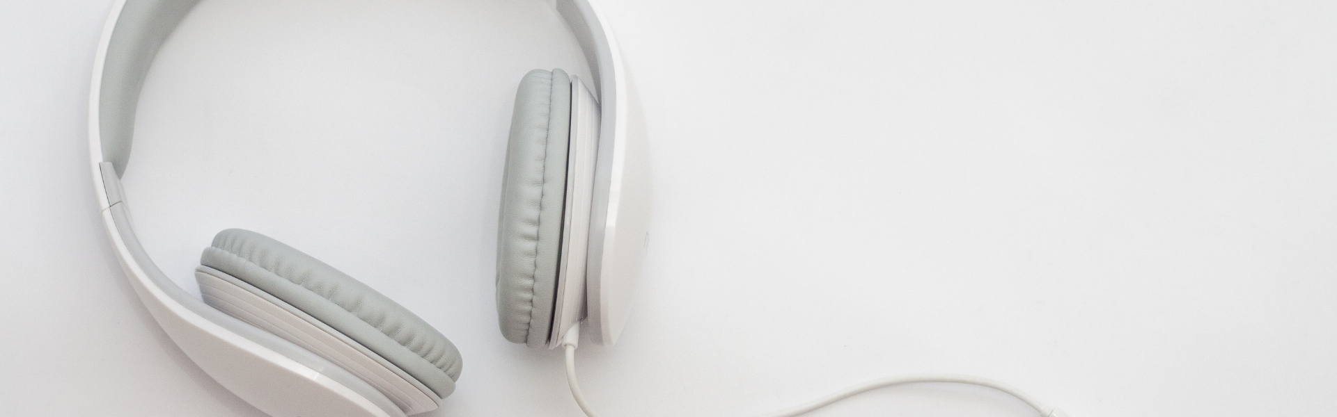 white corded headphones with grey ear pads