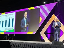 Chief Economist of the American Trucking Associations Bob Costello on stage at the ATA Management Conference sharing insights on the trucking industry's recovery.