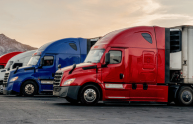semi trucks with mountains in background