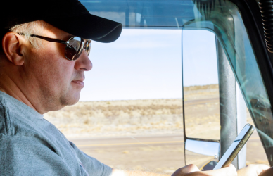 truck driver looking at phone