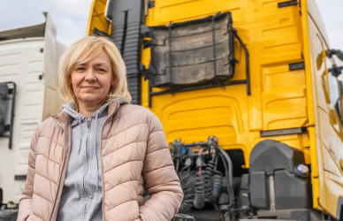 woman with yellow semi truck