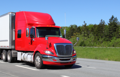 Red semi truck on road