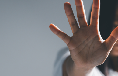 Woman with hand up