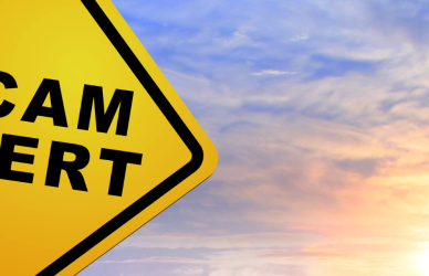 scam alert road sign