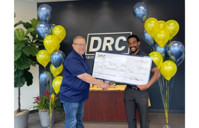 Jason Little, right, receives the first Future of Trucking Scholarship from Driver Resource Center.