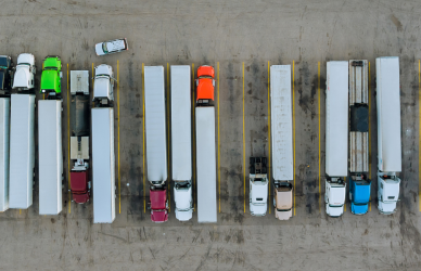 parked semi trucks in semi truck parking lot : The federal government is investing $4.2 billion in infrastructure, creating 260 new truck parking spaces through grants from the Bipartisan Infrastructure Law.
