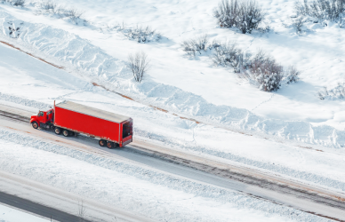 red semi truck on snowy road