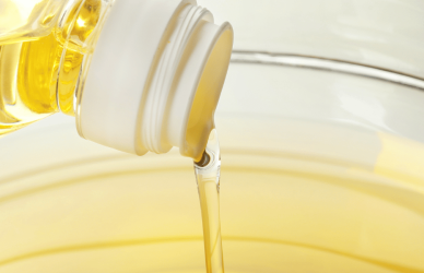 Vegetable oil pouring into bowl