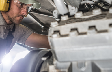 diesel technician working on engine